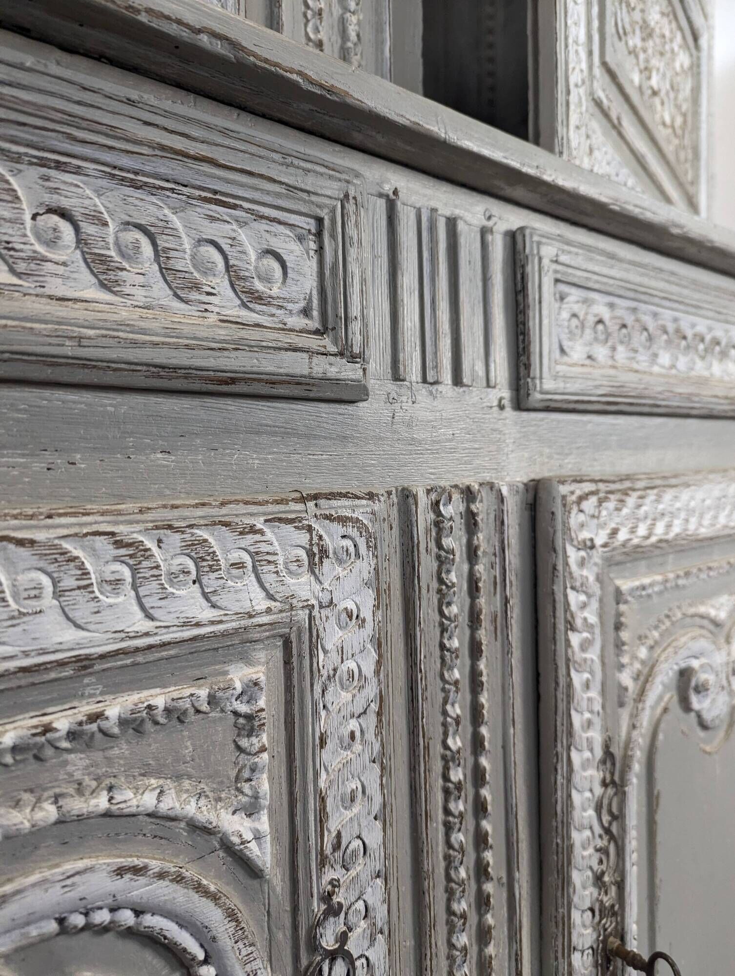 Two-body glass buffet in patinated grey and white oak.