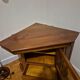 Wooden TV unit with a rotating top.