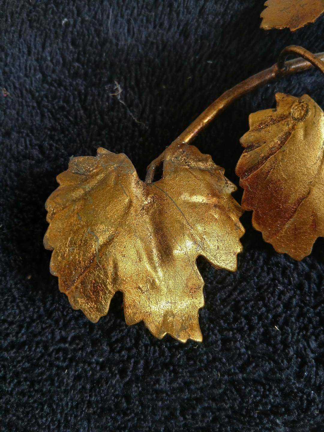 Stunning vintage wall lights in gilded iron with vine and grape decor from Italy.