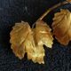 Stunning vintage wall lights in gilded iron with vine and grape decor from Italy.