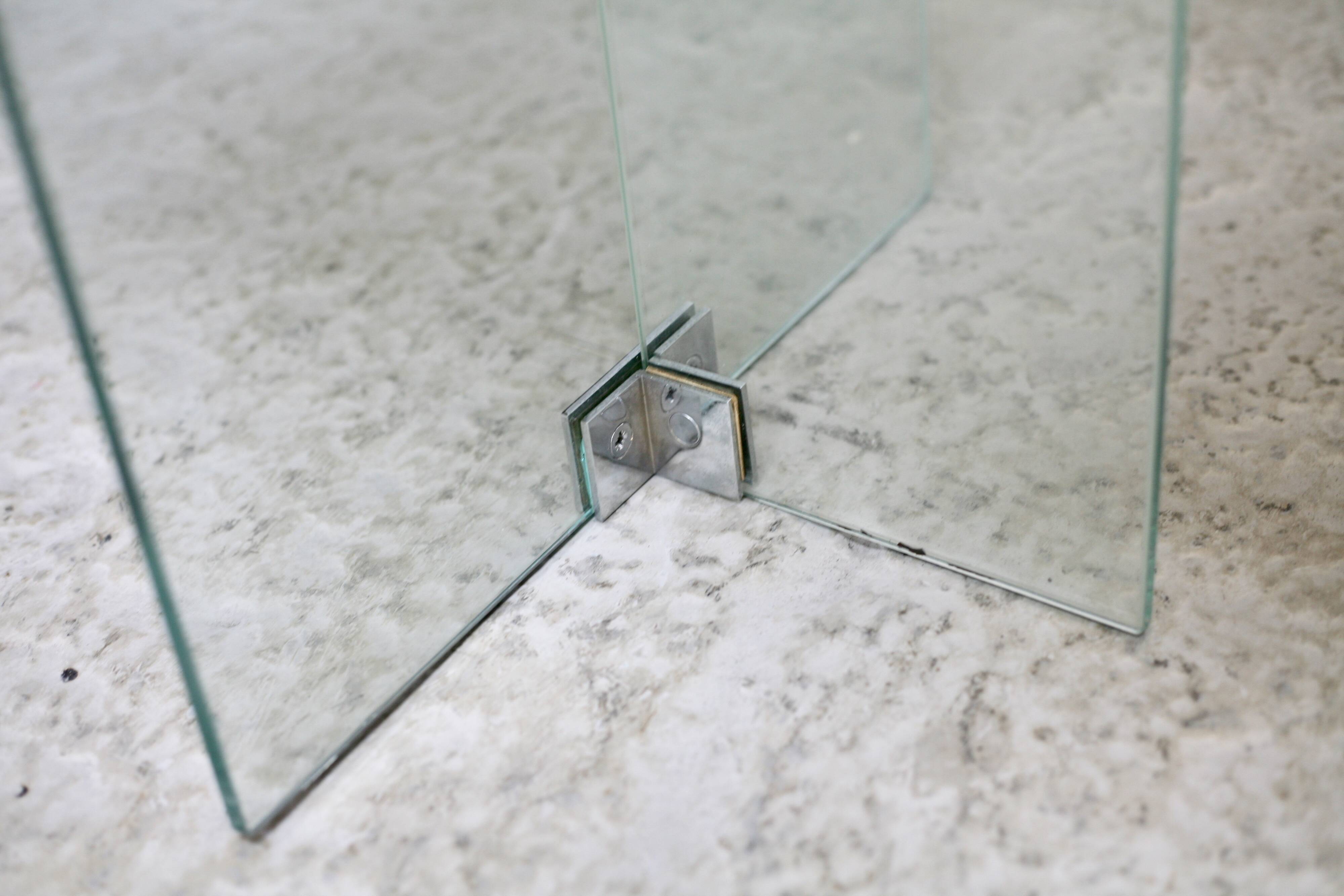 Modernist console, 1960s, glass base, wooden and fabric top.