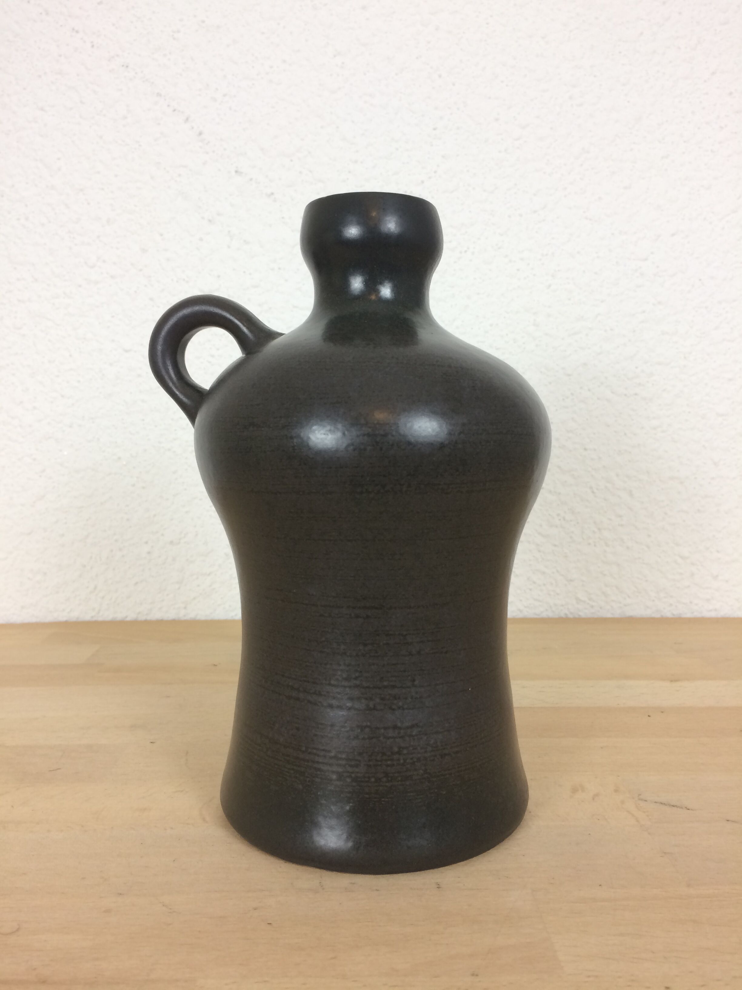 Black ceramic vase with handle