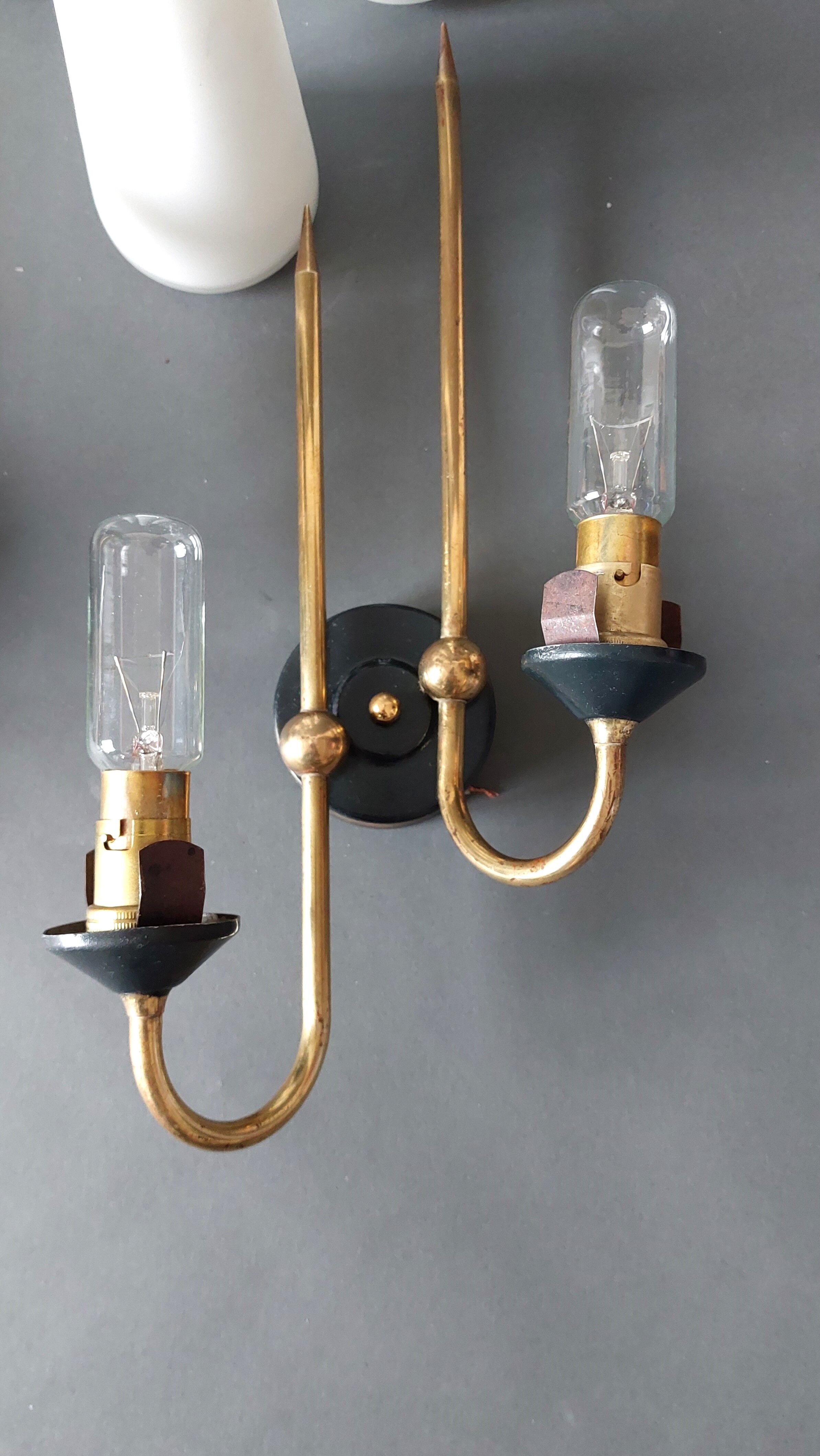 Pair of sconces in black metal and gilded brass 1960 Vintage.