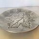 Silver tray with maple leaves in stainless steel.