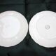 Two slip plates decorated with fruit.