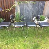 4 Chairs with chrome tubular metal base and black Skaï