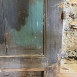 Old glazed wooden door patinated