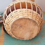 Amber glass decanter dressed in wicker, vintage