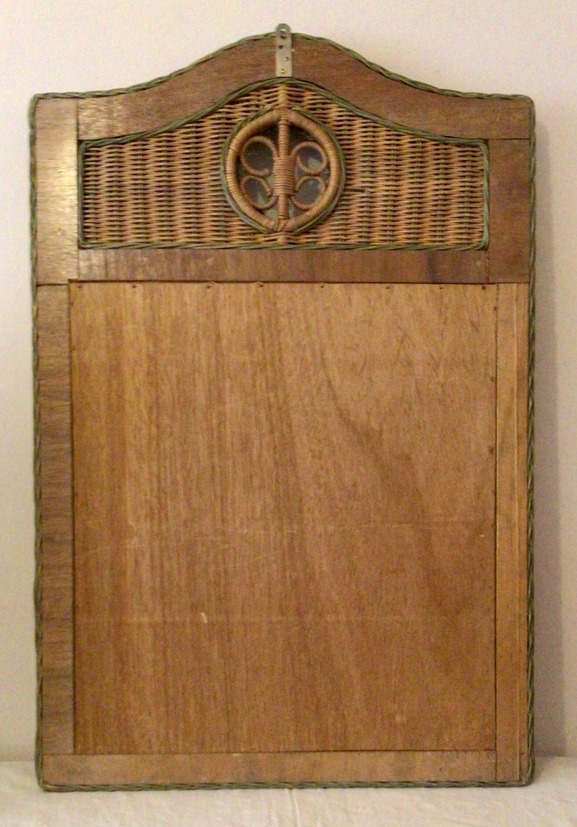 Vintage braided rattan mirror.