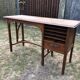 Old oak desk with curved wooden sleepers in the Art Nouveau spirit of the early 20th century.