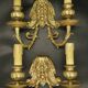 Pair of wall sconces with grotesque heads in 19th-century Renaissance style - bronze