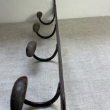 Coat rack, four hooks, in wrought iron.