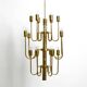 Three staged 18 arm Mid Century brass chandelier with a long brass rod