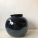 Glazed blue ceramic vase