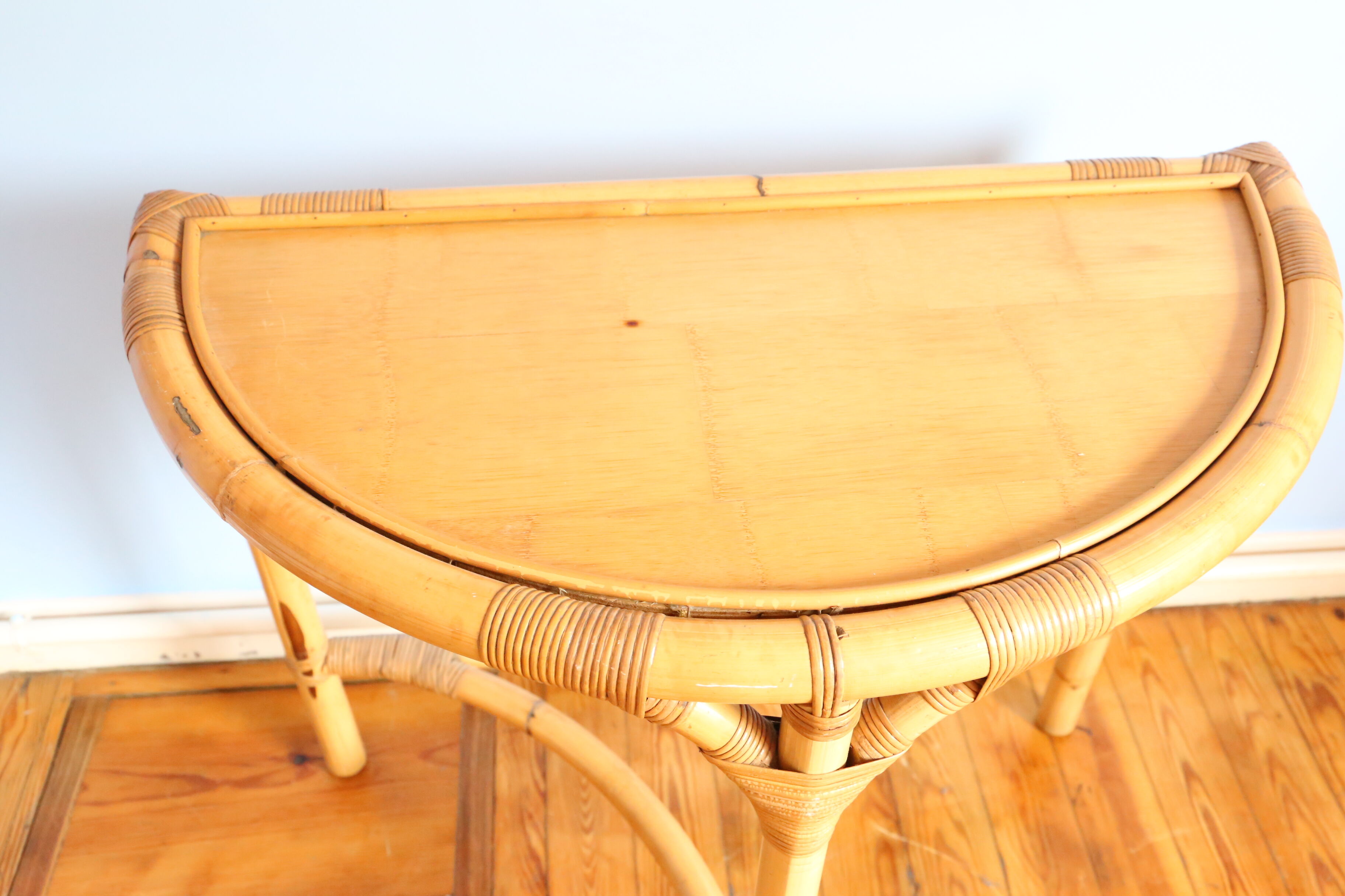 Half-moon rattan console