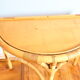 Half-moon rattan console