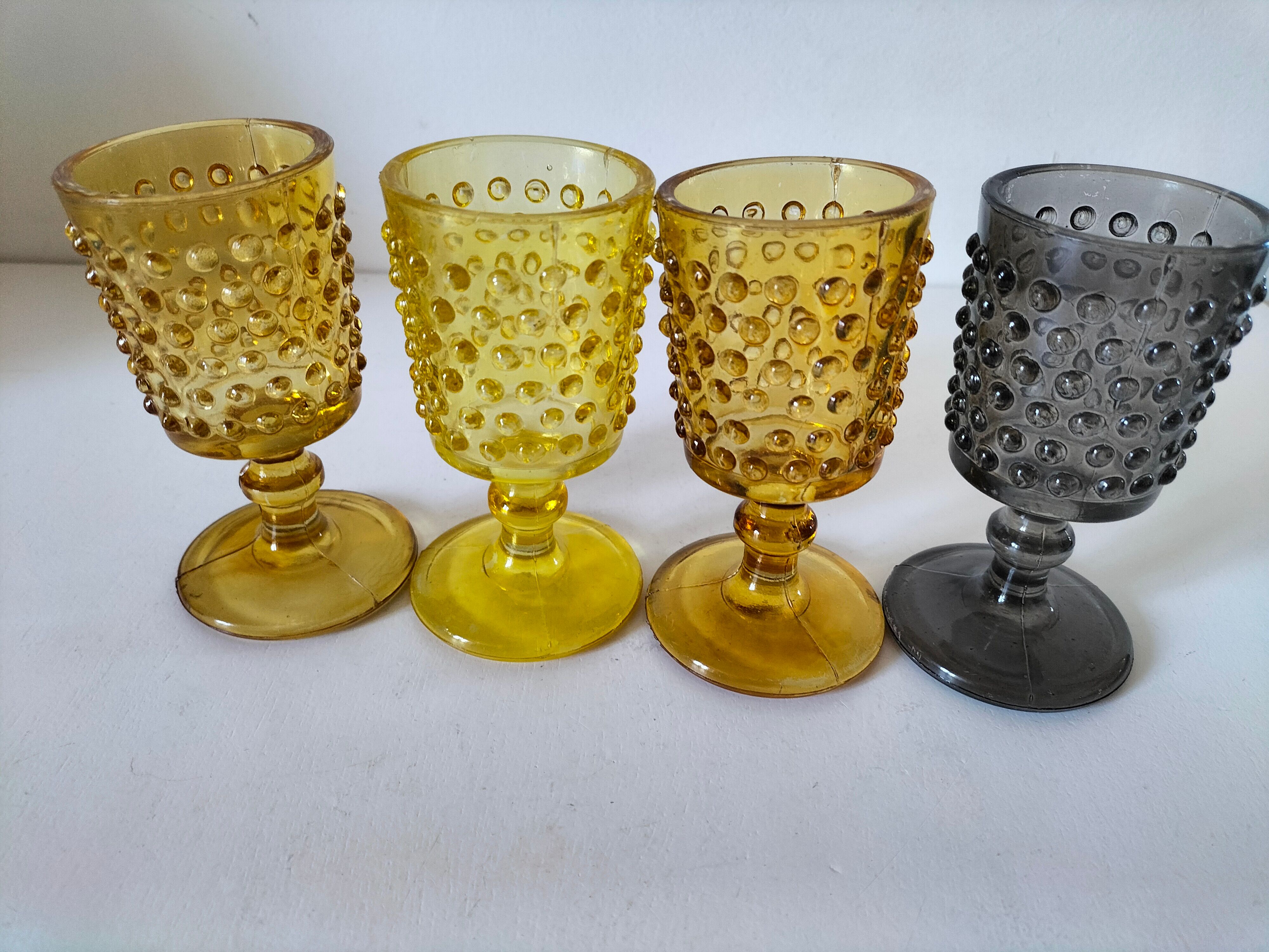 4 vintage stemmed glasses in hobnail glass and smoke colour.