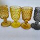 4 vintage stemmed glasses in hobnail glass and smoke colour.
