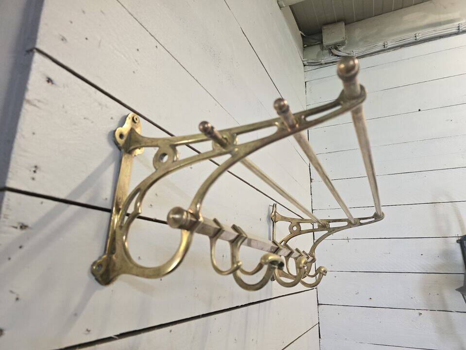 Wall-mounted coat rack with brass hat rack
