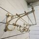 Wall-mounted coat rack with brass hat rack