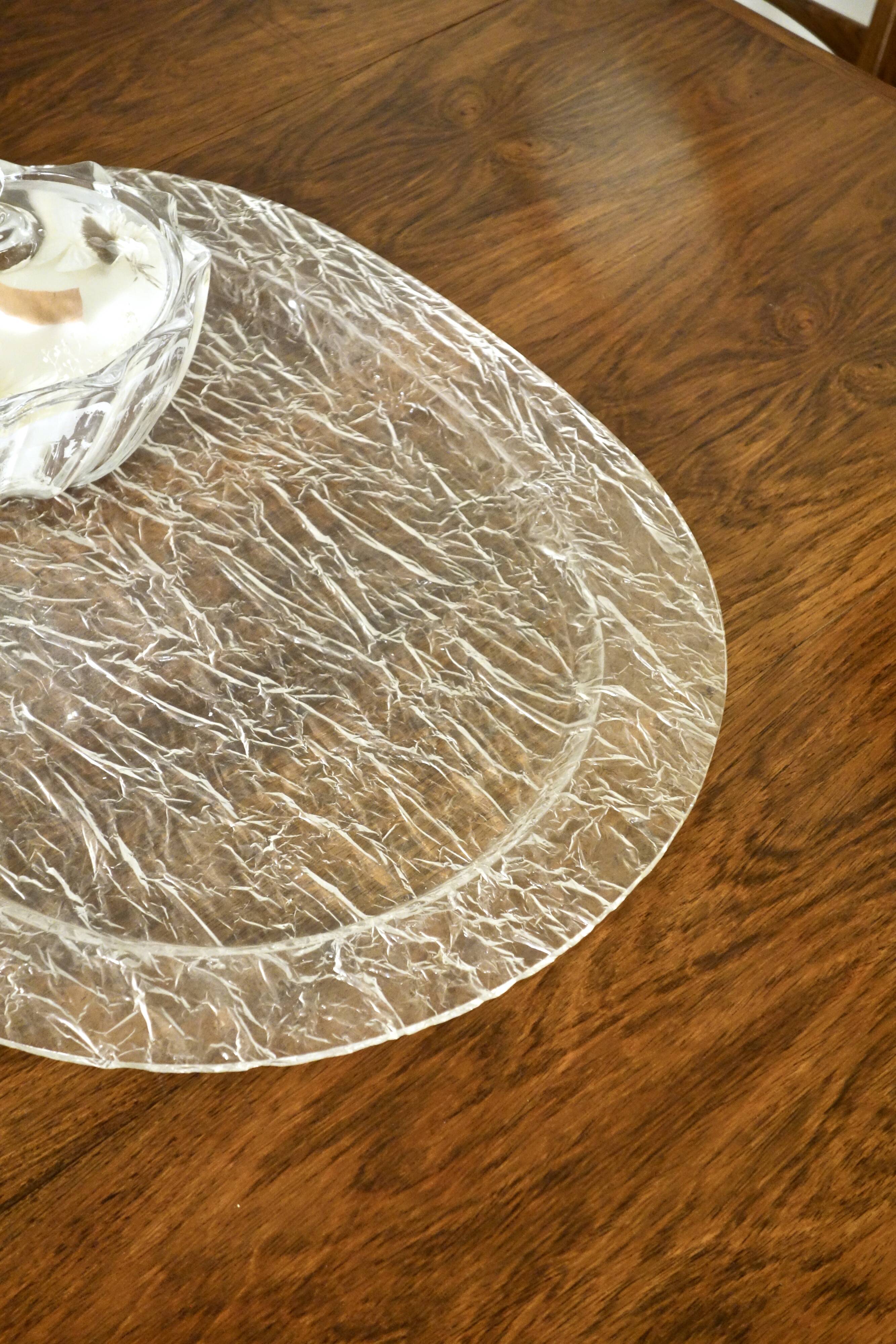 Large oval tray in crumpled plexiglass, France 1970's