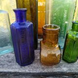 Set of old bottles colored glass