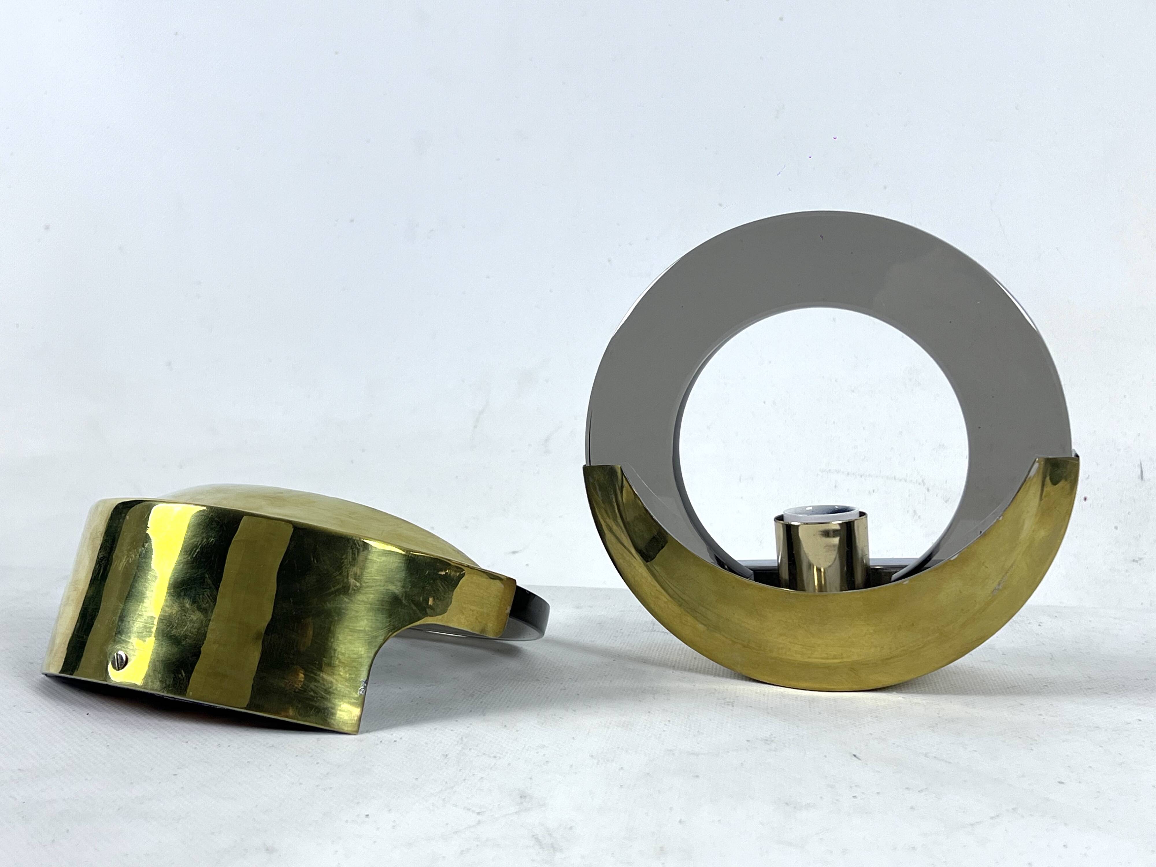 Mid-Century Modern pair of brass and thick smoked glass sconces. Italy 1970s