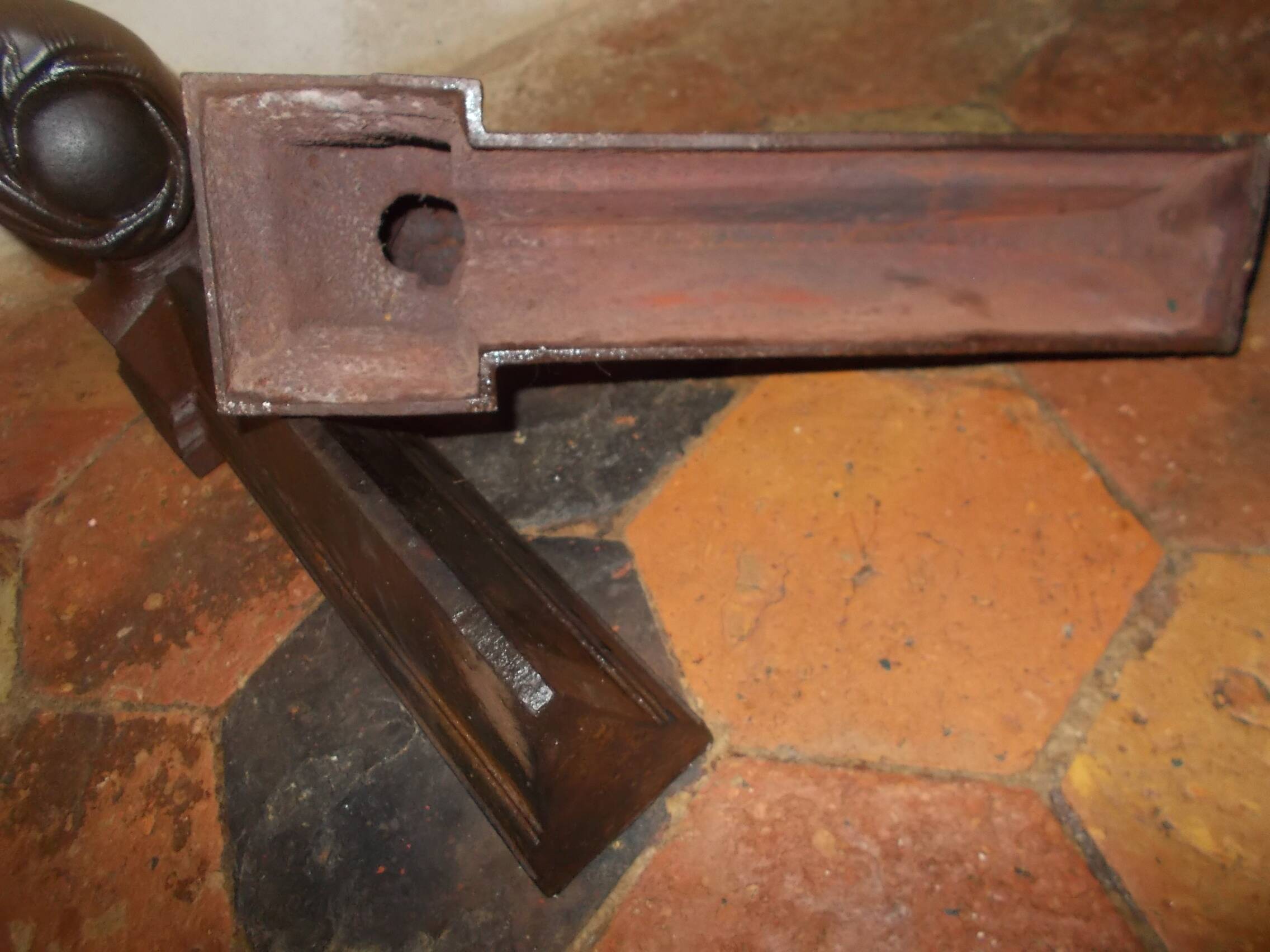 Old cast iron andirons with oriental decor