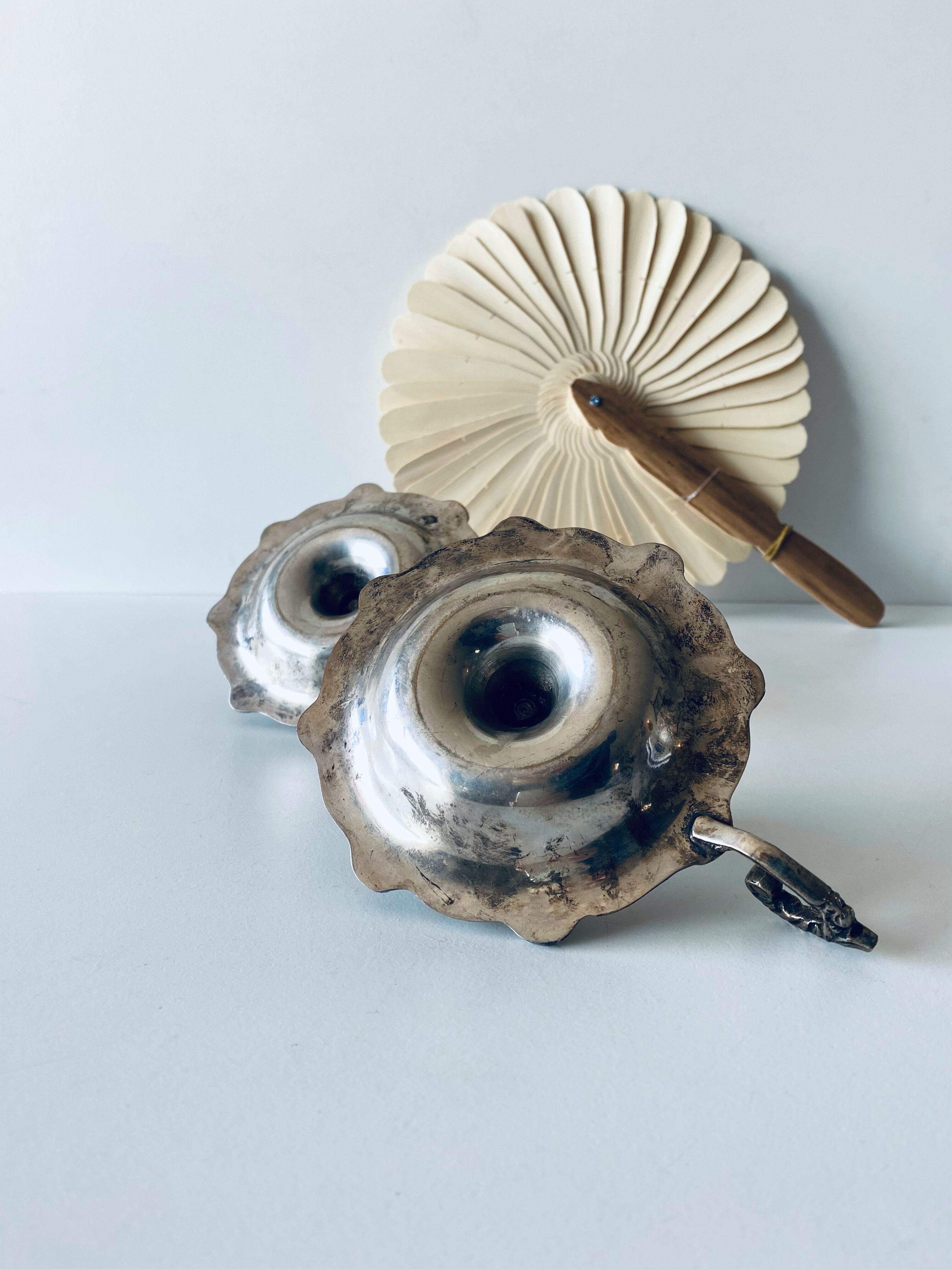 Pair of silver metal candlesticks