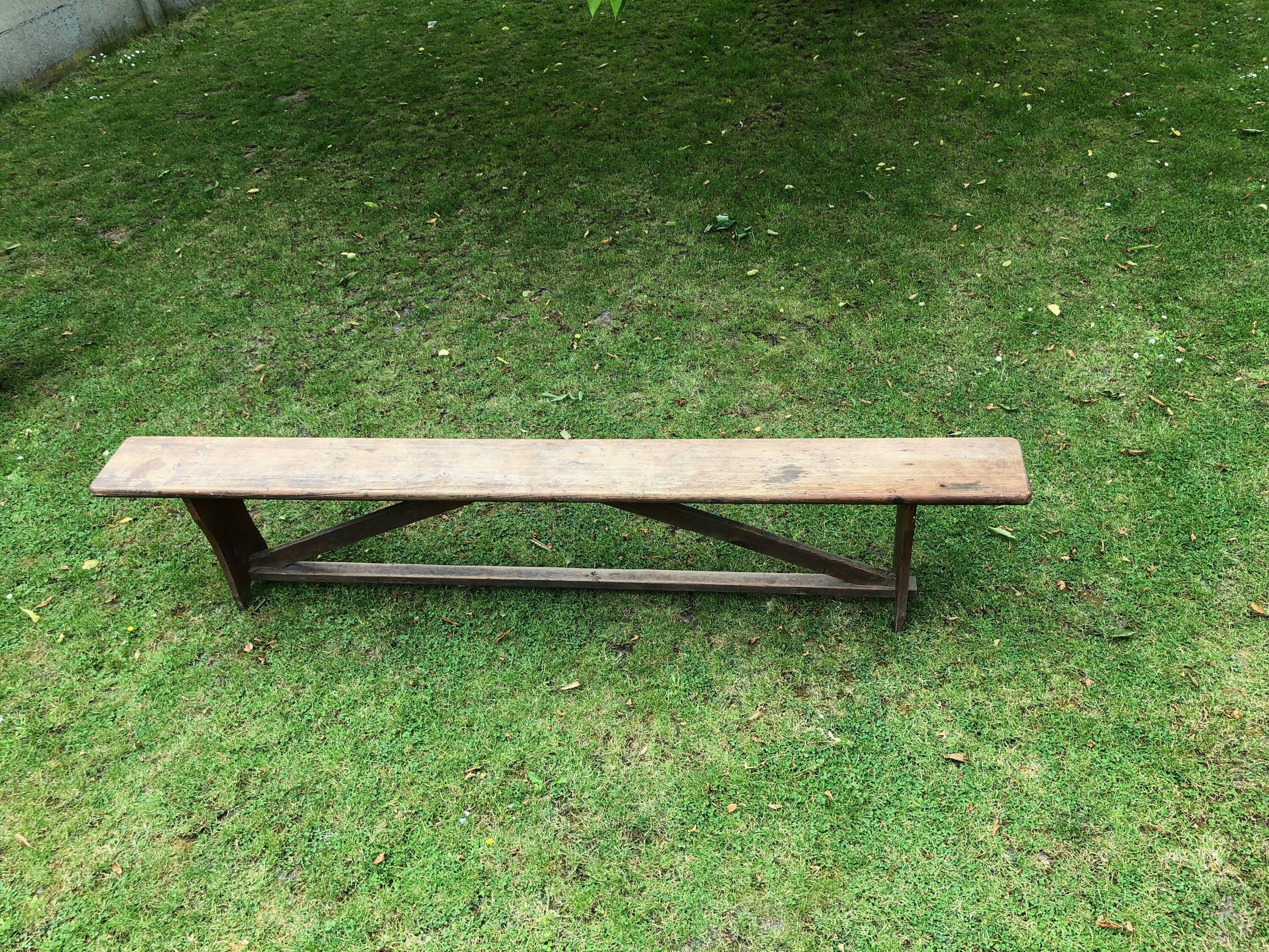 Old solid wood farm bench