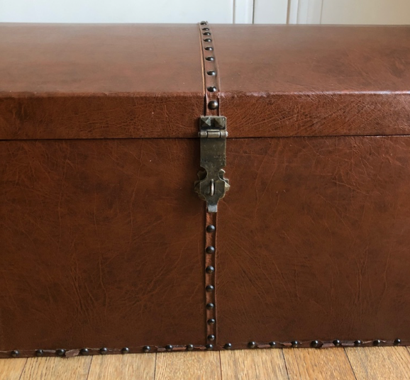 Ancient wooden and faux leather trunk