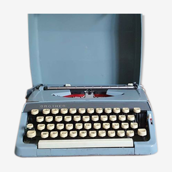 Blue Brother typewriter in its transport case