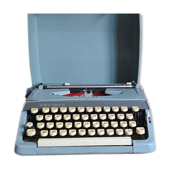 Blue Brother typewriter in its transport case