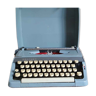 Blue Brother typewriter in its transport case