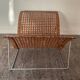 Magazine holder in woven rattan and metal