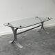 Design coffee table in brushed metal with a glass top, 1970s.