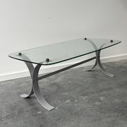 Design coffee table in brushed metal with a glass top, 1970s.