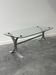 Design coffee table in brushed metal with a glass top, 1970s.