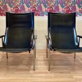 Set of 2 black leather and chrome reclining chairs designed by Hans Eichenberger.
