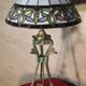 Antique patinated bronze regulator lamp with Tiffany glass shade in very good condition