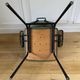 Vintage chair with green imitation leather armrests