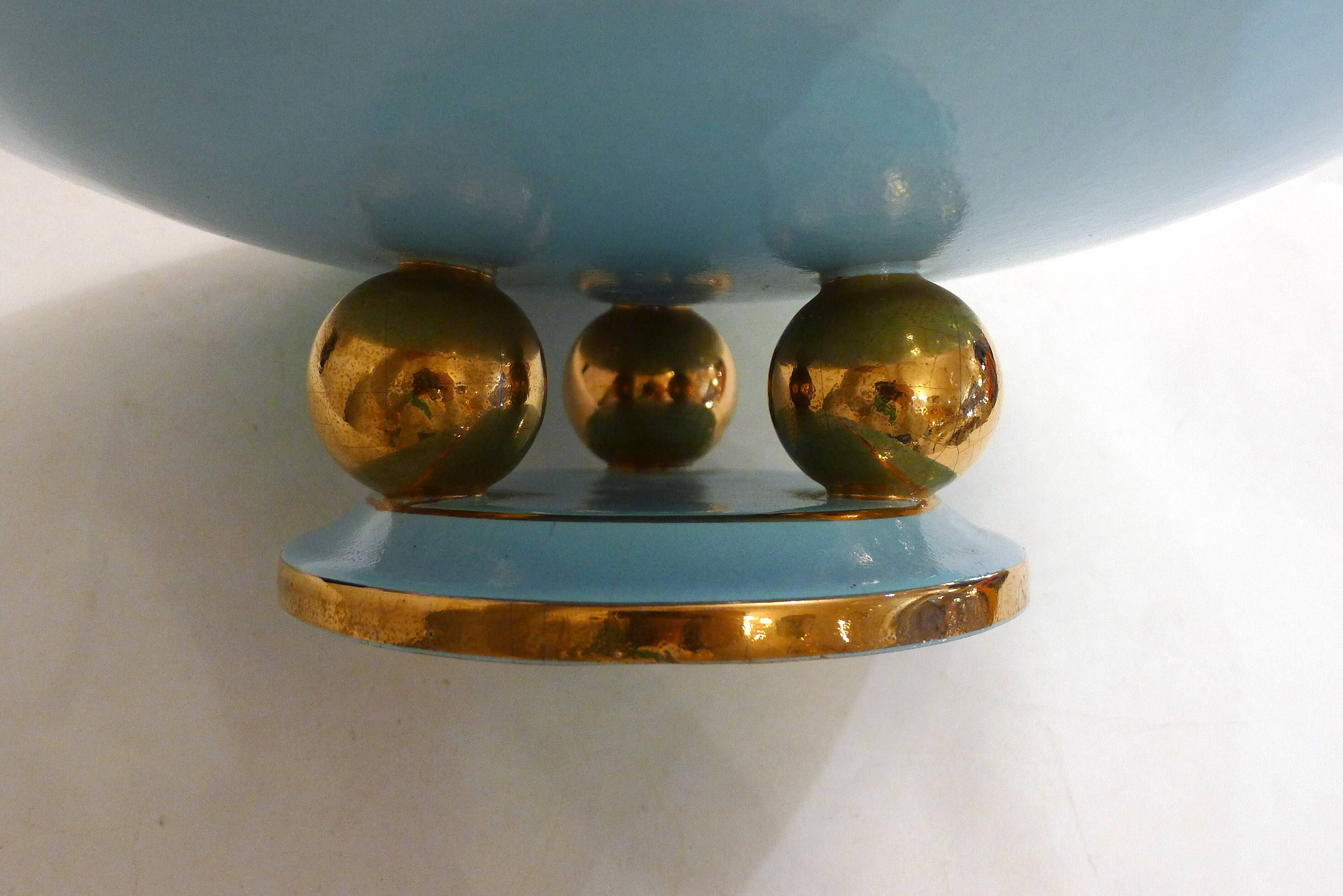 Art Deco modernist coupe, with a base of 3 spheres, in turquoise ceramic and gilding.
