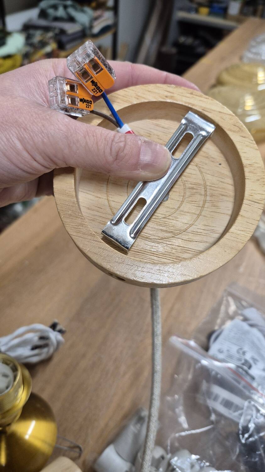 Wall lamp flower made of rattan and fir green linen.