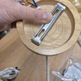 Wall lamp flower made of rattan and fir green linen.