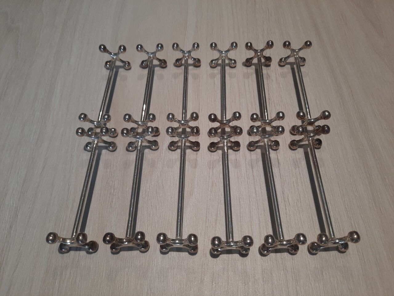 Set of 12 silver metal knife holders