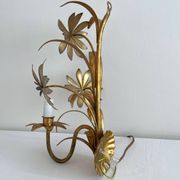 Vintage Hollywood Regency gold metal leaf wall sconce.