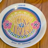 Flat colored porcelain plate, day of the week