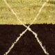 Hand-knotted low pile rug in vibrant earth tones by Anzal | 152 x 264 cm