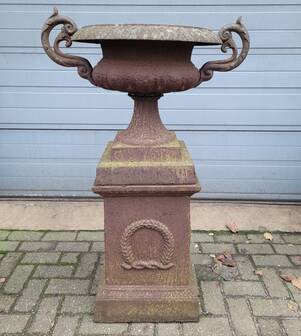 Cast iron garden urn on pedestal with handles