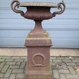 Cast iron garden urn on pedestal with handles